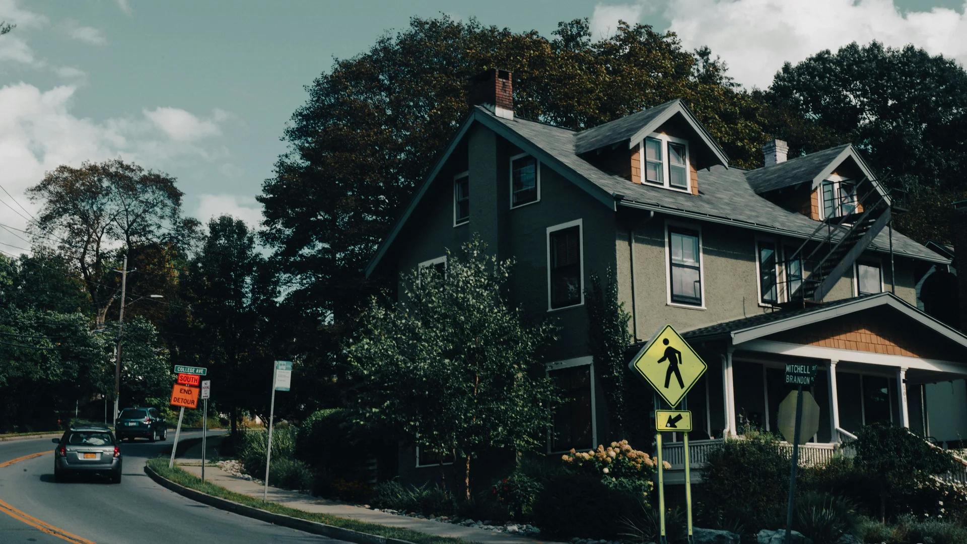 Quiet detached house on a suburban street, representing the ordinary residential settings where most cardiac arrests occur.